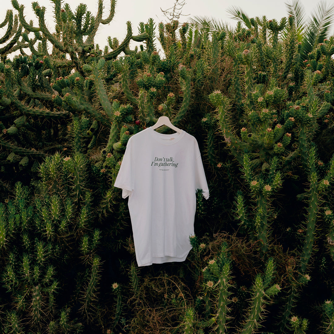 'DON'T TALK, I'M GATHERING' T-SHIRT: WHITE